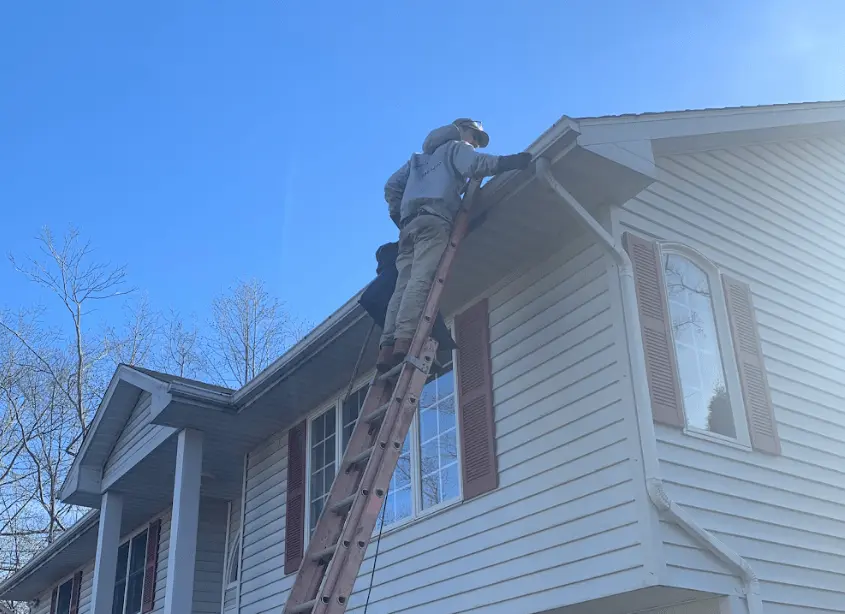 Gutter cleaning and maintenance being performed by Wadsworth Power Washing in Wadsworth